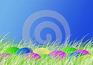 Easter dyed eggs in the spring grass