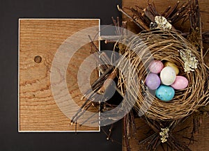 Easter egg candy in a nest with a frame