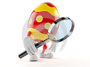 Easter egg character looking through magnifying glass