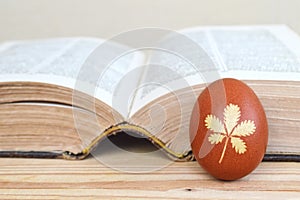 Easter egg colored naturally and old book