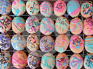 Easter egg cookies with pastel icing and sprinkles