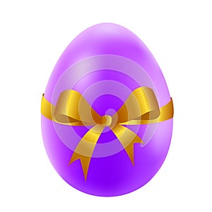 Easter egg with golden bow and ribbon
