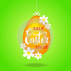 Easter egg hanging on a string with flowers as a sale tag