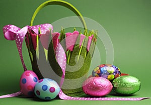 Easter egg hunt with colorful Spring theme polka dot carry basket bag and chocolate Easter eggs