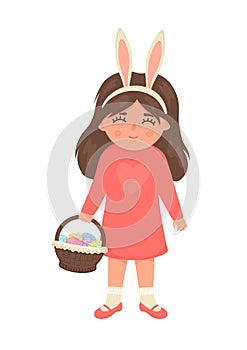 Easter egg hunt. Cute little girl in bunny ears holding basket