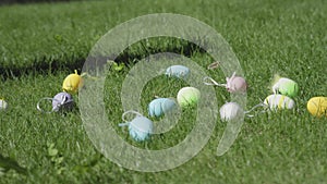 Easter egg hunt game start colorful Easter eggs falling down green grass