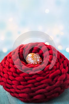 Easter egg in knitted nest