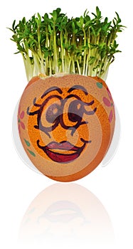 Easter egg painted in a funny smiley girl face and colorful patterns with cress like hair.