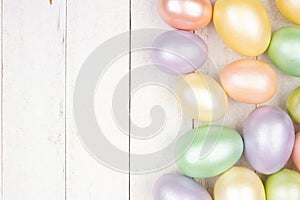 Easter Egg side border over a white wood background