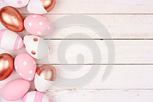 Easter egg side border. Rose gold, pink and white on white wood.