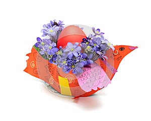 Easter egg with spring flower and bird