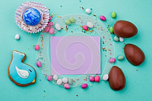 Easter egg, sweets and blank card.