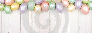 Easter Egg top border over a white wood banner background