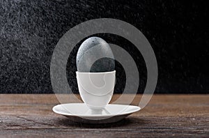 Easter egg with water drops