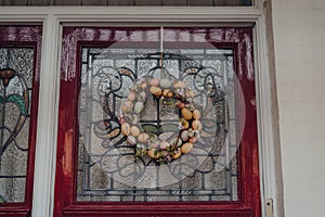 Easter egg wreath on a stained glass door of a house in London, UK