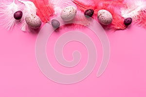 Easter eggs with birds feather. Decoration concept, top view