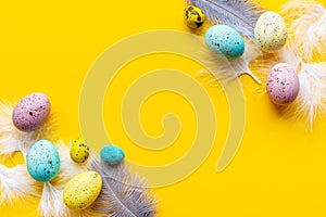 Easter eggs with birds feather. Decoration concept, top view