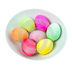 Easter eggs in a bowl on white background