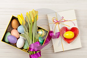 Easter Eggs in a box with colorful tulips