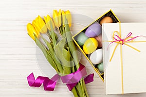 Easter Eggs in a box with colorful tulips