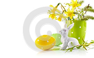 Easter eggs with bunch spring flowers narcissus