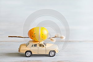 Easter eggs and catkins on car abstract retro concept