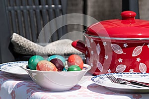Easter eggs in ceramic bowl on table