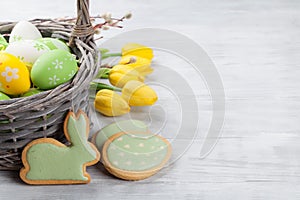 Easter eggs, cookies and tulip flowers