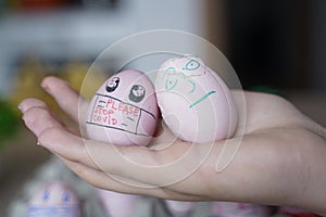 Easter eggs with Corona virus protection concepts. DIY easter eggs wearing mask for Easter holidays decoration. Selective