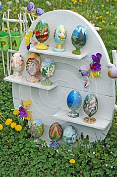 Easter eggs decorated and decorated with colorful ribbons are displayed in the park