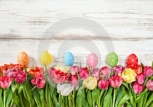 Easter eggs decoration with spring tulip flowers