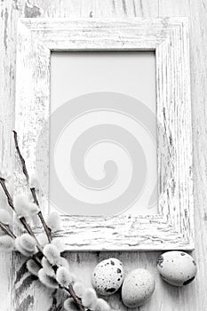 Easter eggs and empty vintage photo frame background