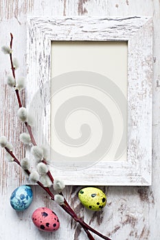 Easter eggs and empty vintage photo frame background