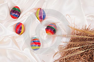 Easter eggs on fabric background