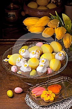 Easter eggs, flowers and muffins, cupcake with sugar decorations for easter