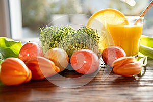 Easter eggs and fresh cress decorated on wood