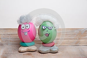 Easter eggs for grandma and grandpa, funny senior faces with big eyes and glasses. handiwork
