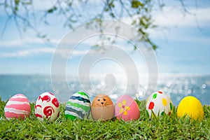 Easter Eggs Grass On the beach, the sea, beautiful