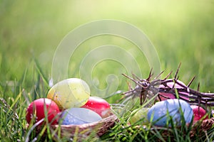 easter eggs in grass with crown of thorns