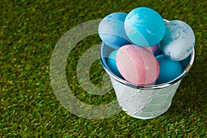 Easter eggs on green grass creative photo.