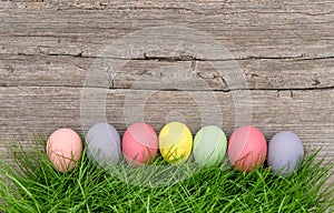 Easter eggs green grass rustic wooden background