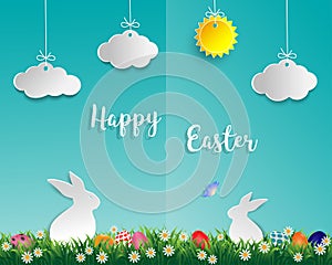 Easter eggs on green grass with white rabbit,little daisy,butterfly,cloud and sun on soft blue background,paper art style