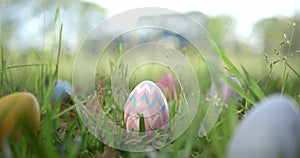 Easter eggs hidden in grass for an Easter egg hunt