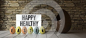 Easter eggs with message HAPPY HEALTHY EASTER with big chocolate egg - 3D rendered illustration