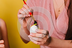 Easter eggs are painted close-up. A believing Christian family getting ready for the holiday