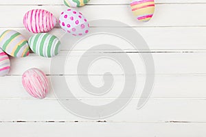 Easter eggs painted in pastel colors on a white