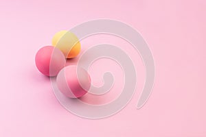 Easter eggs on pink background. Copyspace
