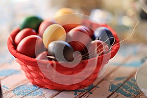 Easter eggs placed in a basket red