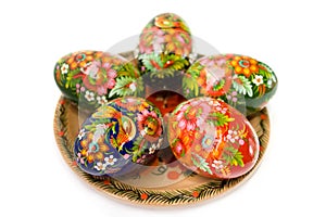 Easter eggs on a plate on white