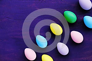 Easter eggs on purple background photo